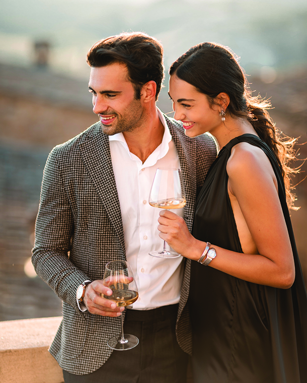 Couple drinking wine at the Toscana Resort Castelfalfi 