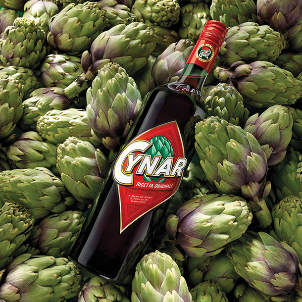 Cynar bottle on top of Artichokes