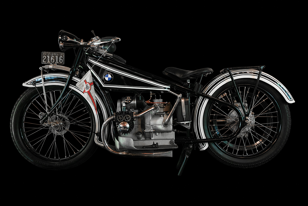 Side view of vintage BMW R32 on black background