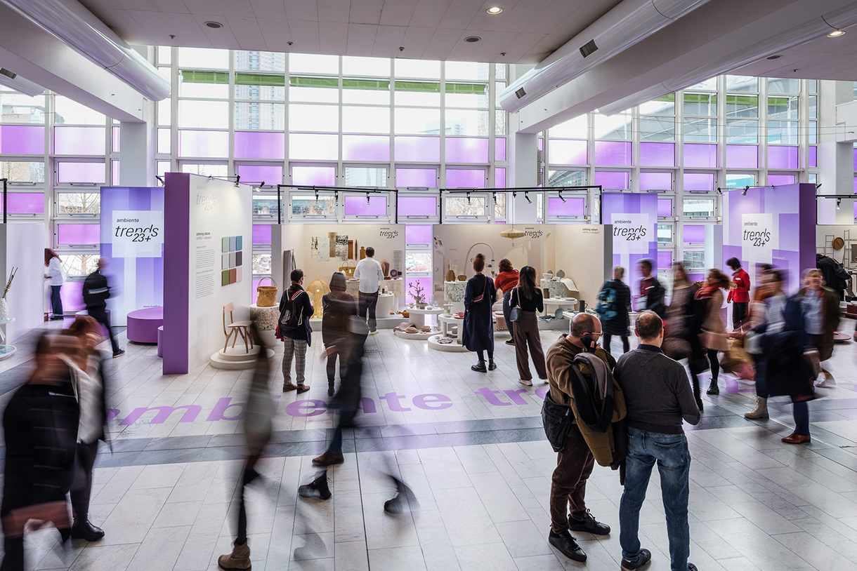 Tradeshow booths and visitors inside the Ambiente Trends Design Show