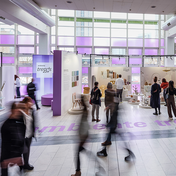 Tradeshow booths and visitors inside the Ambiente Trends Design Show