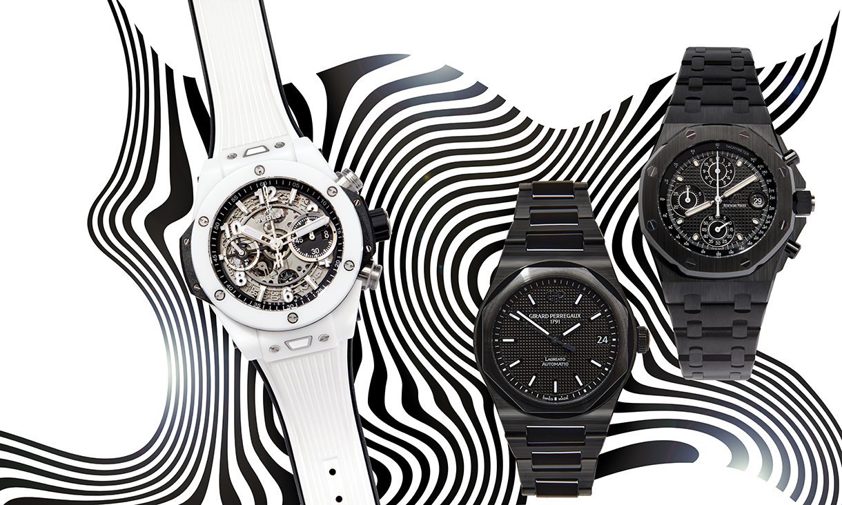 One white and two black ceramic watches on a black and white wavy design backgroun