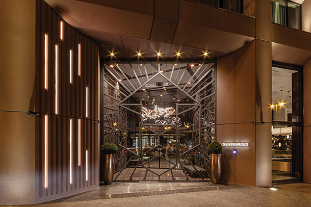 ntrance of Hotel Clark showcasing contemporary architectural elements with unique wall, lighting and metal decorative designs 