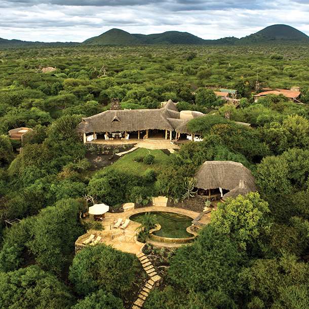 Exterior of ol Donyo Lodge property and outdoor swimming pool in the middle of Chyulu Hills