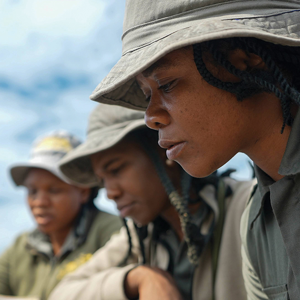 Female rangers receiving instruction and training