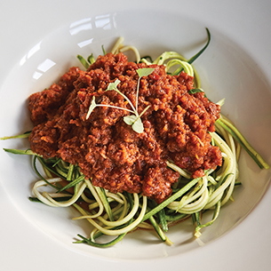 Plant-based entrée of zucchini and marinara sauce