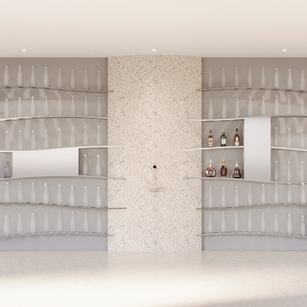 A luxurious, brightly lit, custom water cellar wall filled with bottles of high-end water organized and displayed on a curved, metal shelves stacked from floor to ceiling.