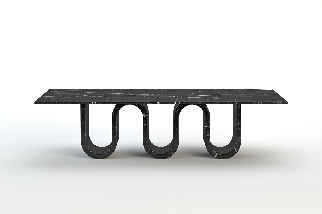 A long, rectangular dining table with a black marble top and curvy base in the shape of waves. 