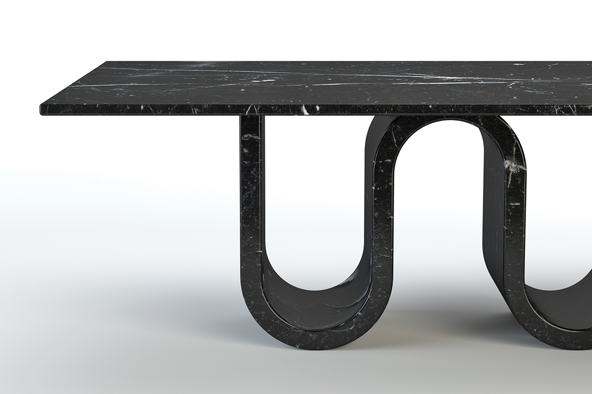 A close-up of a black marble dining table with a unique, wavy base. 