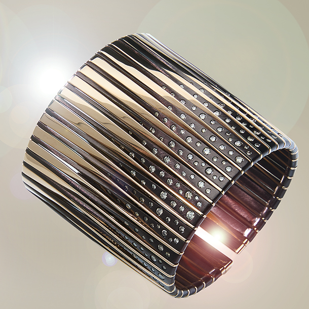 A contemporary mixed metal cuff bracelet in 18k white gold, gunmetal bronze and round brilliant-cut diamonds.