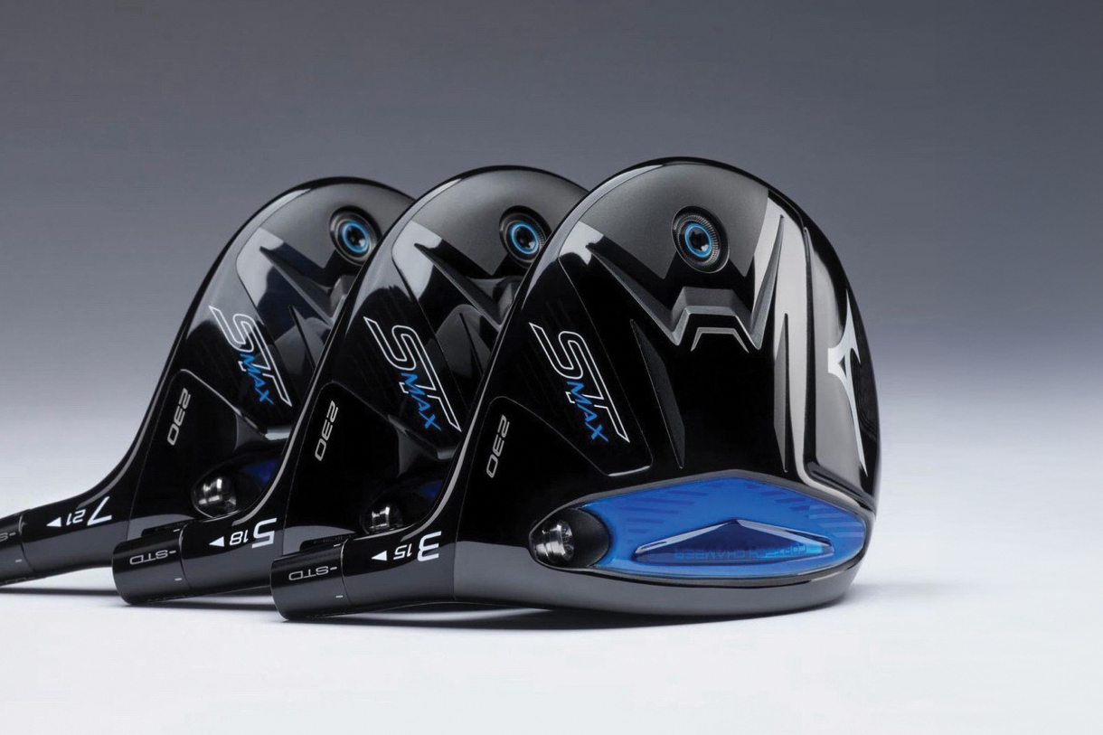 A close-up of three Mizuno ST-MAX 230 fairway woods lined up, showcasing their sleek black design with blue accents.