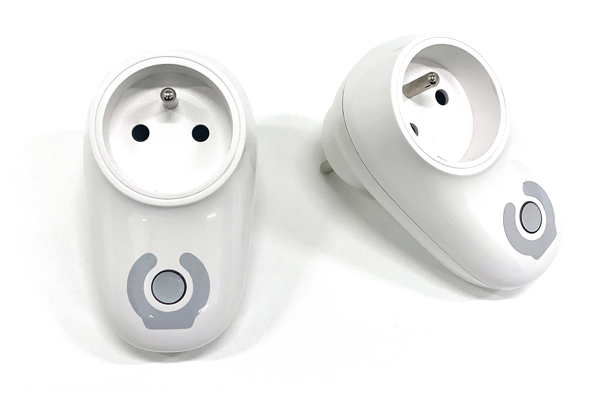 Two white smart plug devices with a round gray button.