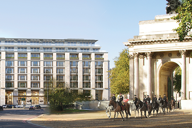 A parade of cavalry horses walk through the Wellington Arch in front of the Peninsula Hotel in London. 