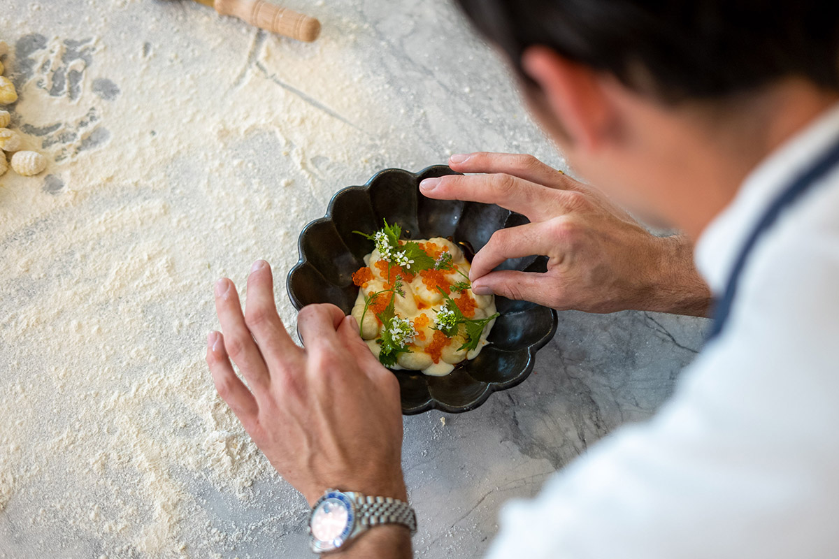 A chef putting final touches on a high end dessert. Executive Chefs at Home connects top chefs with clients seeking high-end private dining experiences. Founded by NYC-based chef Brian Arruda. 